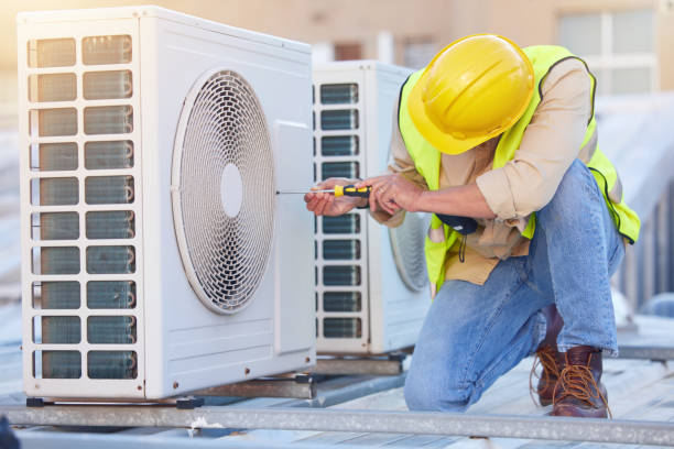 Image of an AC unit being serviced